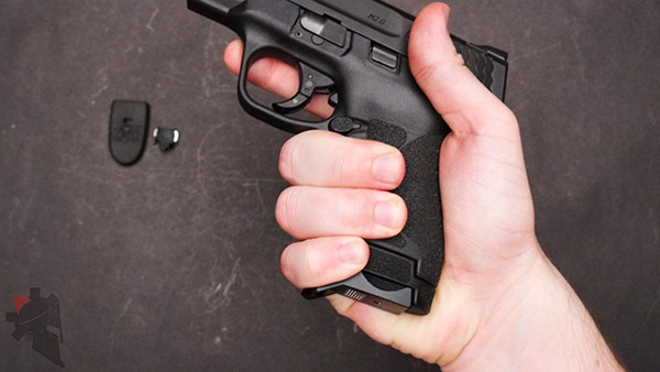 Showing the grip extension for Bastion Gear magazine baseplate on smith and wesson shield