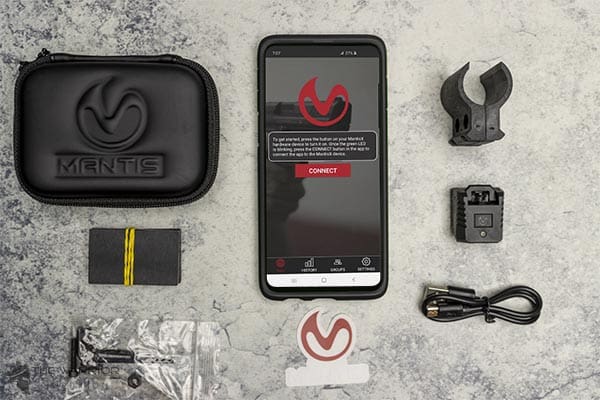 MantisX 10 complete kit with app open on phone flat lay